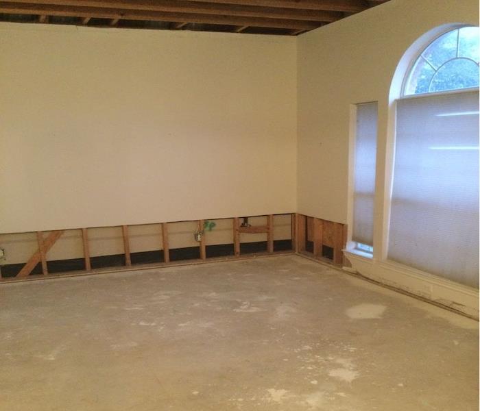 The Living Room carpet is removed and 2ft flood cuts done on the walls.